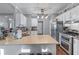 Modern kitchen with stainless steel appliances, a double oven, and ample counter space at 705 Branch Tree Way, Lawrenceville, GA 30043