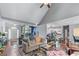 Bright, open-concept living room with hardwood floors flows seamlessly into the kitchen and entryway at 705 Branch Tree Way, Lawrenceville, GA 30043
