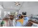 Comfortable living room featuring a cozy fireplace and hardwood floors at 705 Branch Tree Way, Lawrenceville, GA 30043