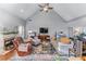 Inviting living room features vaulted ceilings, a cozy fireplace, and comfortable seating arrangement at 705 Branch Tree Way, Lawrenceville, GA 30043