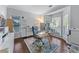 Well-lit home office with hardwood floors and ample natural light at 705 Branch Tree Way, Lawrenceville, GA 30043
