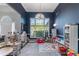Bright playroom with large window, hardwood floors, and ample natural light at 705 Branch Tree Way, Lawrenceville, GA 30043