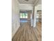 Inviting foyer with beautiful wood flooring and wainscoting, leading into an open living space at 1685 Crumbley Rd, Mcdonough, GA 30252