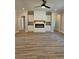 Cozy living room with a modern fireplace, built-in cabinets, and ample space for entertaining at 1685 Crumbley Rd, Mcdonough, GA 30252