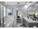 Bright bathroom with walk-in shower, soaking tub, and a view to the main bedroom at 3568 Foxworth Ct, Buford, GA 30519