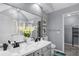 Bathroom featuring double vanity, a large mirror, and plenty of counter space at 3568 Foxworth Ct, Buford, GA 30519