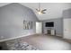 Spacious bedroom with vaulted ceiling, carpet floors, and a ceiling fan at 3568 Foxworth Ct, Buford, GA 30519
