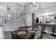 Contemporary dining area next to the kitchen featuring stairs, a large dining table, and seating for six at 3568 Foxworth Ct, Buford, GA 30519