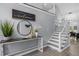 Spacious home foyer with a staircase, attractive decor and warm, welcoming design elements at 3568 Foxworth Ct, Buford, GA 30519