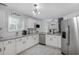 Bright kitchen features stainless steel appliances, granite countertops and white subway tile backsplash at 3568 Foxworth Ct, Buford, GA 30519