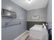 Functional laundry room equipped with washer, dryer and shelving for storage and decor at 3568 Foxworth Ct, Buford, GA 30519