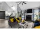 Bright living room with high ceilings, a fireplace, and an open floor plan into the kitchen at 3568 Foxworth Ct, Buford, GA 30519