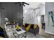 Inviting living room featuring dark accent wall, plush sofas, and an open layout at 3568 Foxworth Ct, Buford, GA 30519