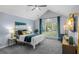 Inviting main bedroom featuring high ceilings, a large window, and stylish furnishings at 3568 Foxworth Ct, Buford, GA 30519