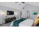 Main bedroom featuring stylish furniture, a TV, and ensuite access at 3568 Foxworth Ct, Buford, GA 30519