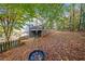 Backyard with a tree swing and a view of the house with a wooden deck at 401 Briardale Court, Woodstock, GA 30189