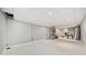 Unfinished basement featuring tile ceilings, gray walls, and carpet flooring at 401 Briardale Court, Woodstock, GA 30189
