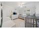 Bedroom with a white dresser, a baby bed, a bed with a patterned cover, and a ceiling fan at 401 Briardale Court, Woodstock, GA 30189
