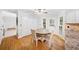 Bright breakfast nook features a ceiling fan, access to the backyard, and beautiful hardwood floors at 401 Briardale Court, Woodstock, GA 30189