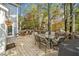 Wooden deck with outdoor seating, a grill, and a scenic view of surrounding trees at 401 Briardale Court, Woodstock, GA 30189