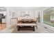 Elegant dining room with large windows, bench seating, and a modern light fixture at 401 Briardale Court, Woodstock, GA 30189