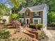 Beautiful two-story brick home with well-maintained landscaping and an attached garage at 401 Briardale Court, Woodstock, GA 30189
