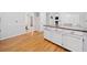 Charming kitchen with stainless steel appliances, hardwood flooring, and granite countertops at 401 Briardale Court, Woodstock, GA 30189