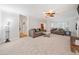 Comfortable living room with plush seating and view of front entry stairs at 401 Briardale Court, Woodstock, GA 30189