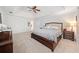 Large main bedroom features trey ceilings, ensuite bath, sitting area, and lots of natural light at 401 Briardale Court, Woodstock, GA 30189