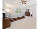 Spacious main bedroom with tray ceilings, ensuite bath, sitting area, and lots of natural light at 401 Briardale Court, Woodstock, GA 30189