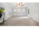 Bright sunroom featuring neutral walls, and multiple windows offering ample natural light at 401 Briardale Court, Woodstock, GA 30189