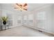Bright sunroom featuring neutral walls, and multiple windows offering ample natural light at 401 Briardale Court, Woodstock, GA 30189