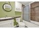 Well-lit bathroom featuring a shower-tub combo, stylish vanity, and modern fixtures at 4653 Anns Se Trce, Acworth, GA 30102