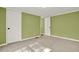 Cozy bedroom featuring two white doors and neutral carpet at 4653 Anns Se Trce, Acworth, GA 30102