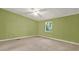 Bright bedroom featuring green walls, a window, and neutral carpeting at 4653 Anns Se Trce, Acworth, GA 30102
