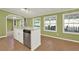 Kitchen features an island with a stainless steel dishwasher and a view to the deck through a window at 4653 Anns Se Trce, Acworth, GA 30102