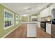 Open kitchen with stainless steel appliances, granite countertops and bright green walls at 4653 Anns Se Trce, Acworth, GA 30102