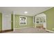Comfortable living room with lots of natural light, neutral carpet, and green walls at 4653 Anns Se Trce, Acworth, GA 30102