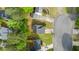Aerial view of home, driveway, roof, and surrounding yard with mature trees at 536 Crestridge Ct, Stone Mountain, GA 30083