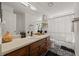 Clean bathroom with a wood vanity, neutral decor, and decorative flooring at 536 Crestridge Ct, Stone Mountain, GA 30083