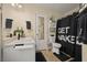 Functional bathroom with a shower, a white vanity, and neutral decor at 536 Crestridge Ct, Stone Mountain, GA 30083