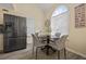 Bright breakfast nook with a round table, natural light, and stainless steel fridge at 536 Crestridge Ct, Stone Mountain, GA 30083