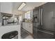 Modern kitchen featuring stainless steel appliances, granite countertops, and a stylish backsplash at 536 Crestridge Ct, Stone Mountain, GA 30083