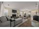 Cozy living room featuring a fireplace, neutral decor, and wood flooring with ample natural light at 536 Crestridge Ct, Stone Mountain, GA 30083