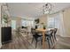 Open-concept living area with wood floors, a dining space, and lots of natural light at 536 Crestridge Ct, Stone Mountain, GA 30083