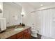 Bathroom featuring granite counters and a tiled shower and tub at 620 Glen Iris Ne Dr # 410, Atlanta, GA 30308