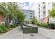 Exterior courtyard view with water feature and mature landscaping at 620 Glen Iris Ne Dr # 410, Atlanta, GA 30308