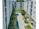 Beautiful courtyard view featuring mature trees and manicured landscaping with fountain at 620 Glen Iris Ne Dr # 410, Atlanta, GA 30308