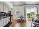 Open concept living space with stainless steel appliances, and a walk-out balcony at 620 Glen Iris Ne Dr # 410, Atlanta, GA 30308