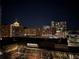 Downtown buildings with visible lights and a night sky at 620 Glen Iris Ne Dr # 410, Atlanta, GA 30308